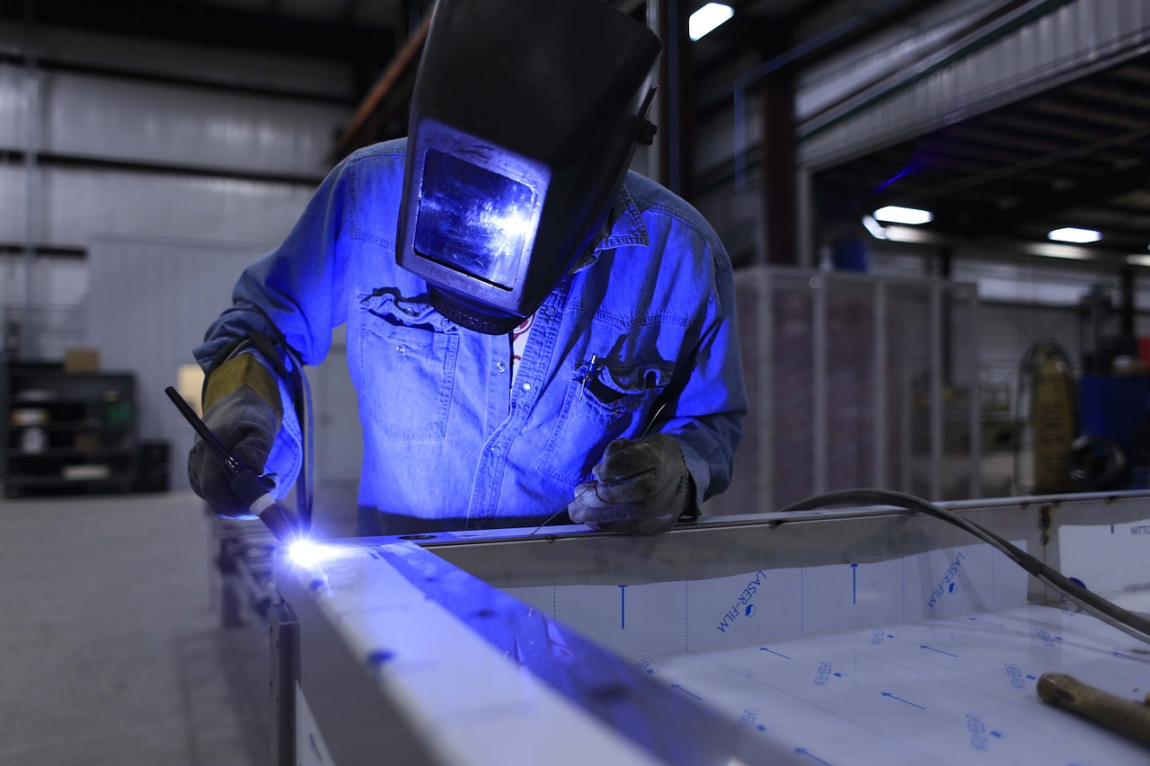 man welding metal